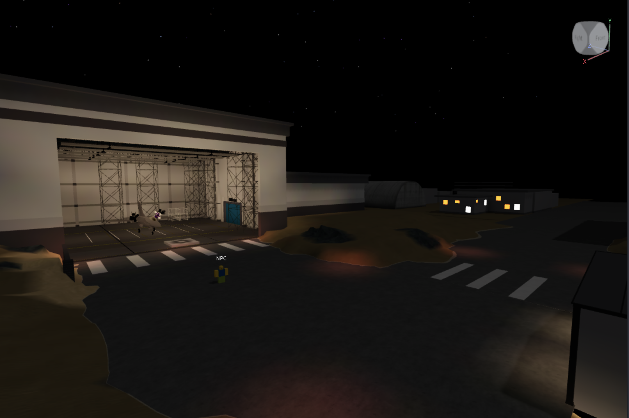 Site RECALL exterior development view, showing a building entrance at night